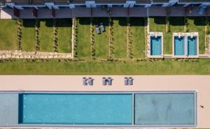 an overhead view of a building with the word hotel at Oikos Sani Suites in Sani Beach