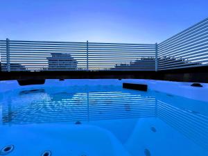 a swimming pool with a view of a building at Hotel Adria B&B - Colazione fino alle 12 in Misano Adriatico
