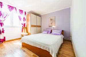 Postel nebo postele na pokoji v ubytování Uvala Apartment
