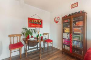 a dining room with a table and two chairs at Alnwick Book Nook - dog friendly in Alnwick