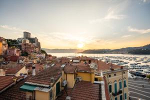 a view of a city with boats in a harbor at Torretta San Rocco -Luxury Suite in Lerici