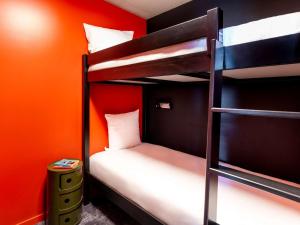 Postel nebo postele na pokoji v ubytování ibis Styles Paris Villejuif