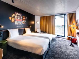 Postel nebo postele na pokoji v ubytování ibis Styles Paris Villejuif