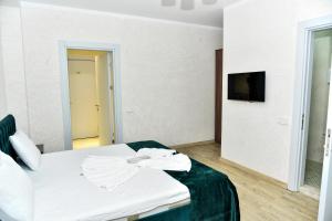 Postel nebo postele na pokoji v ubytování Avrasya Inn Hotel