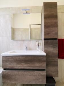 a bathroom with a sink and a mirror at Casa dell’Artista in Luino +42 photos