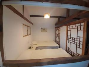 Postel nebo postele na pokoji v ubytování New Hanok