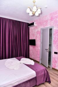 Postel nebo postele na pokoji v ubytování Avrasya Inn Hotel