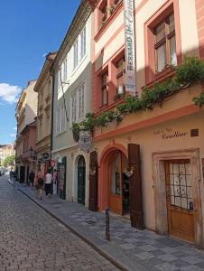 a cobblestone street in a city with buildings at Prague centrum house in Prague