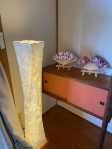 Postel nebo postele na pokoji v ubytování 慶村 歌舞伎