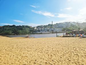 a sandy beach with a view of a river at Ramsgate Palms 3 in Ramsgate