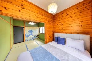 Postel nebo postele na pokoji v ubytování 慶村 歌舞伎