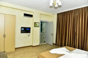 Postel nebo postele na pokoji v ubytování Avrasya Inn Hotel