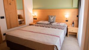 Postel nebo postele na pokoji v ubytování Hotel Bellevue