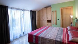 Postel nebo postele na pokoji v ubytování Hotel Bellevue