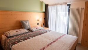 Postel nebo postele na pokoji v ubytování Hotel Bellevue