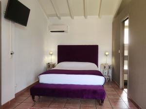 Postel nebo postele na pokoji v ubytování Le Roc E Fiori Hotel - Teritoria