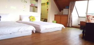 Giường trong phòng chung tại Xian Qing Yu Zhi Homestay