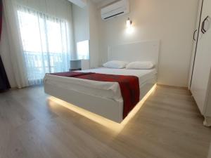 Postel nebo postele na pokoji v ubytování World Cities Residence + 37 fotografií