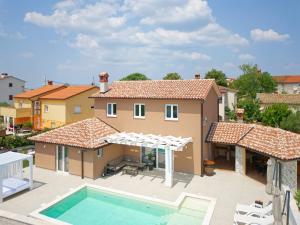 an image of a villa with a swimming pool at Villa Matthias by Rent Istria in Ližnjan