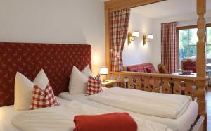 Postel nebo postele na pokoji v ubytování Apartment 10 an der Rottach + 7 fotografií