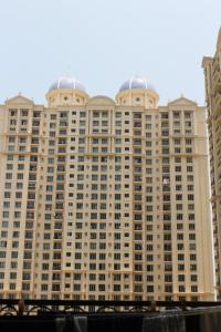 a large building with two domes on top of it at Rockfort stay inn in Oragadam