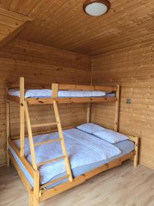 Posteľ alebo postele v izbe v ubytovaní Ozi-Holiday