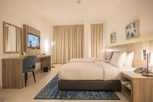 Postel nebo postele na pokoji v ubytování Golden Tulip Amman