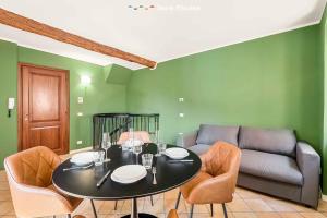 a dining room with a table and a couch at La Perpetua, Terre Marine in Riomaggiore