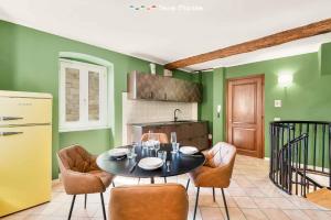 a kitchen with a table and chairs in a room at La Perpetua, Terre Marine in Riomaggiore +8 photos