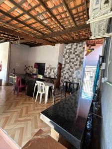 a living room with a table and chairs at Hotel B&B in Santa Inês
