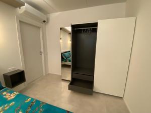 Postel nebo postele na pokoji v ubytování NEW Residenza le Essenze - i 7 Laghi