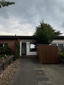 a house with a brick driveway in front of it at Villa Kunterbunt in Nienburg