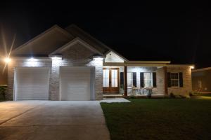 a house with two garage doors at night at Highway Oasis and Myrtle Beach in Arrowood