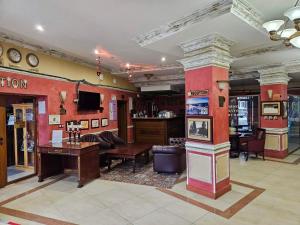 a large room with a bar and a lobby with at Частен Апартамент Пампорово Гранд Манастира 2Б5 in Pamporovo