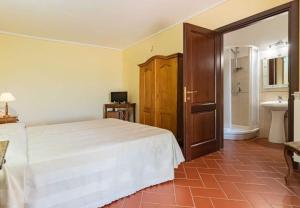 a bedroom with a white bed and a sink at Il Girasole Terzuolo in Manciano +105 photos