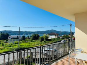 a balcony of a house with a view of the water at Casa de Meruso in San Pedro