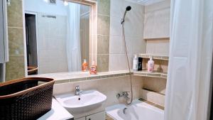 a bathroom with a sink and a toilet and a shower at Meander Natolin Pokoje Blisko Metra in Warsaw +37 photos
