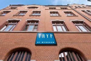 a brick building with a tvp sign on it at Tryp by Wyndham Kassel City Centre in Kassel
