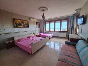 Postel nebo postele na pokoji v ubytování Guest House Maria