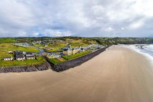 an aerial view of the beach and houses at Ard Na Gaoithe Rossnowlagh Beach in Donegal