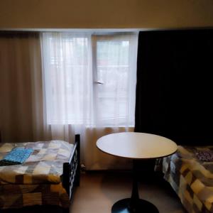 Rúm í herbergi á GUEST HOUSE NATA CHAVCHAVADZE ST.25