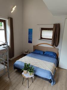 Postel nebo postele na pokoji v ubytování Alloggio Albaluna