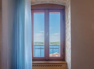 a window with a view of the ocean at Fiammetta in Rovinj