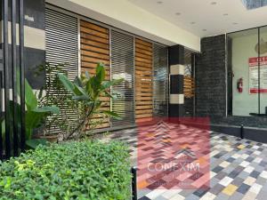a lobby of a building with a tile floor at Fully Furnished One Bed Room Apartment with Kitchen A007 in Dhaka