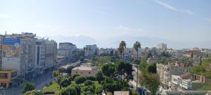 an aerial view of a city with buildings and trees at Safari Otel in Antalya