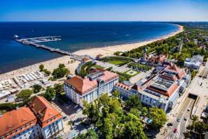 an aerial view of a city and the beach at Sopot Marina Beach Elegance in Sopot