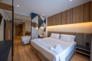 Postel nebo postele na pokoji v ubytování Arel Hotel