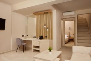 A television and/or entertainment centre at Sofia Resort Luxury Suites