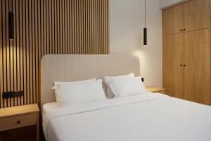 A bed or beds in a room at Sofia Resort Luxury Suites