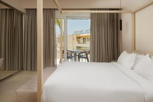 A bed or beds in a room at Sofia Resort Luxury Suites
